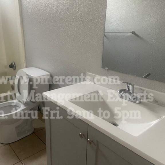 a bathroom with a toilet and a sink