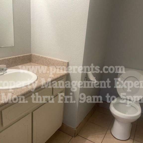 a bathroom with a sink and a toilet