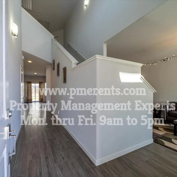 renovated living room and dining room with stairs to the second floor