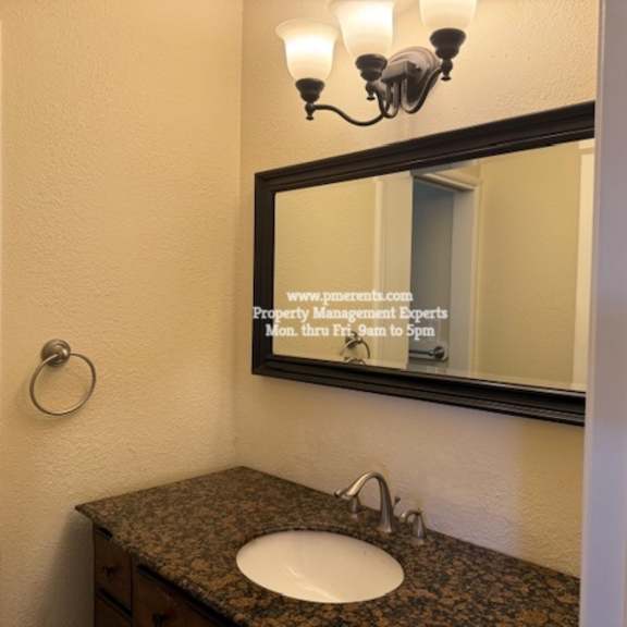 a bathroom sink with a mirror above it.