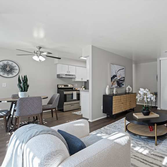 a modern living room with a grey sofa and a coffee table.