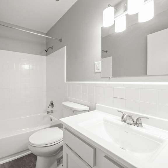 a bathroom with a sink toilet and bathtub