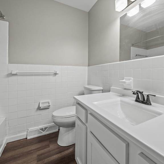 a bathroom with a toilet sink and bathtub