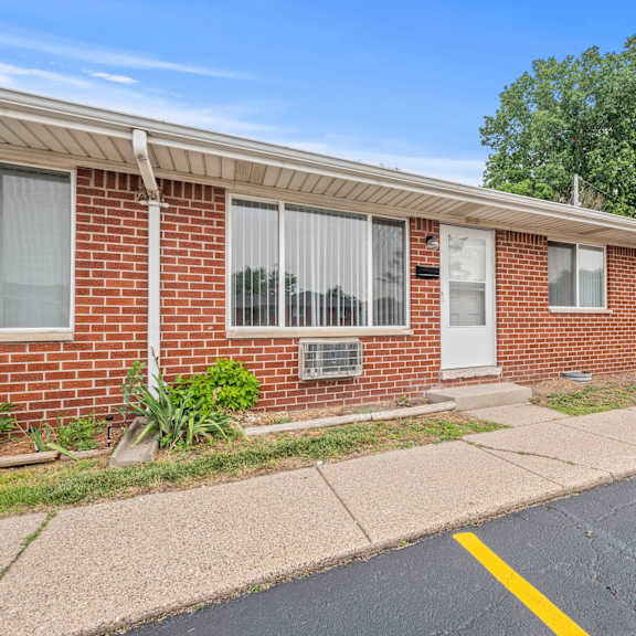 a brick building with a white door