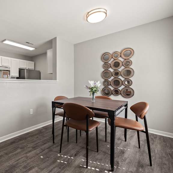 a dining room with a table set for two.