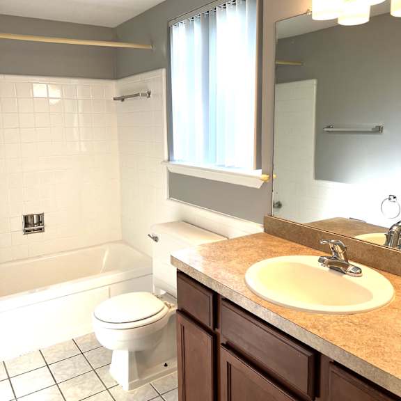 a bathroom with a sink toilet and bathtub
