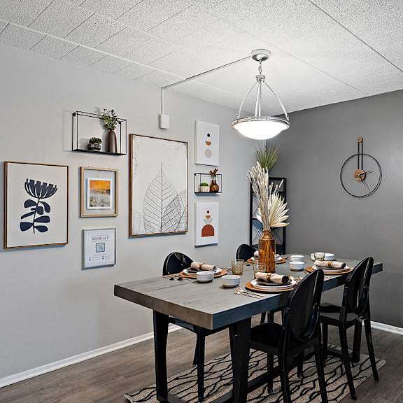 a dining room with a table set for a meal.