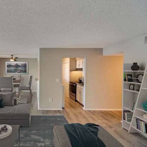 a living room with a grey couch and a coffee table.