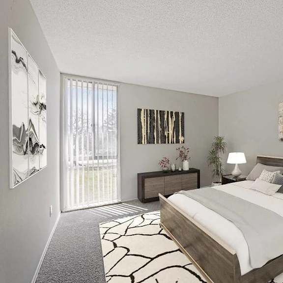 a bedroom with a large bed and a painting on the wall.