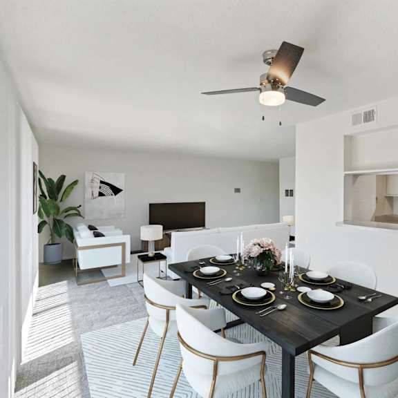 a dining room with a black table set for two.