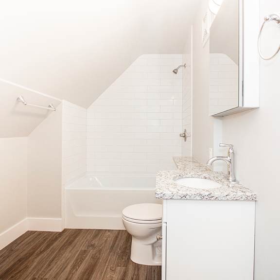 a bathroom with a toilet sink and bathtub