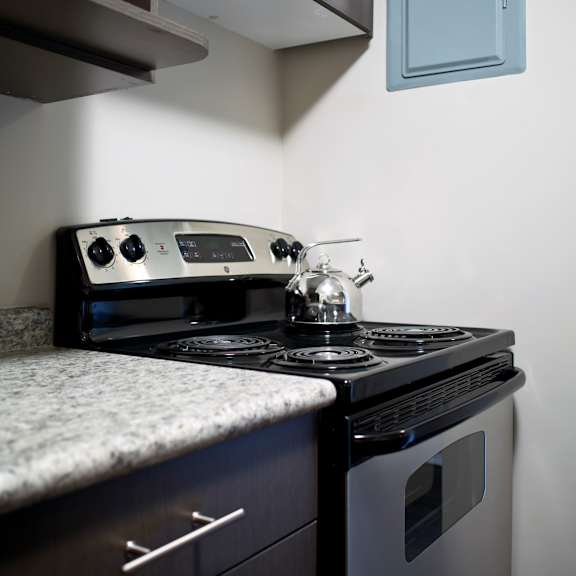 a modern kitchen with a stove and oven.