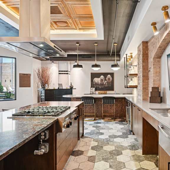 a kitchen with a black and white checkered floor.