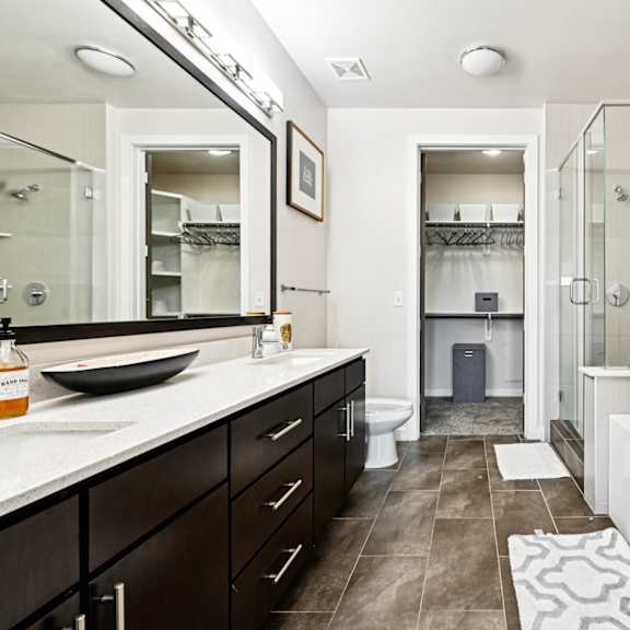 a bathroom with a white tub and a walk in shower.