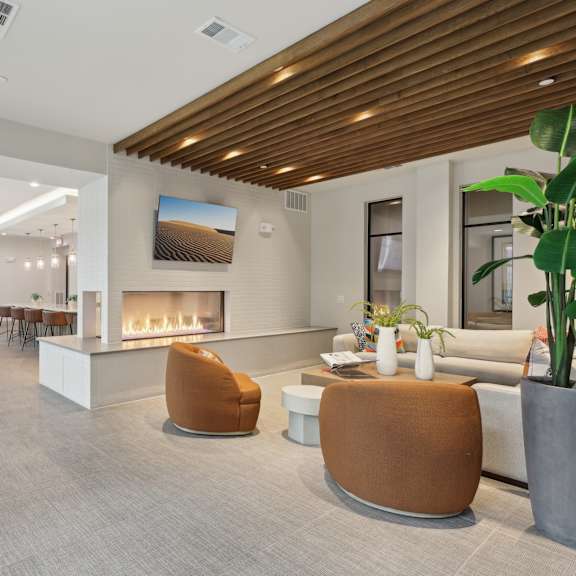 a modern living room with a fireplace and a couch.
