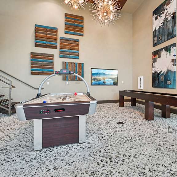 a shiny pool table with a white cloth on it.