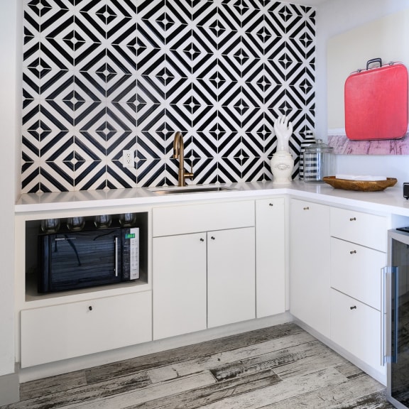 Kitchen with cabinets at The Grove at White Oak Apartments, The Barvin Group, Houston