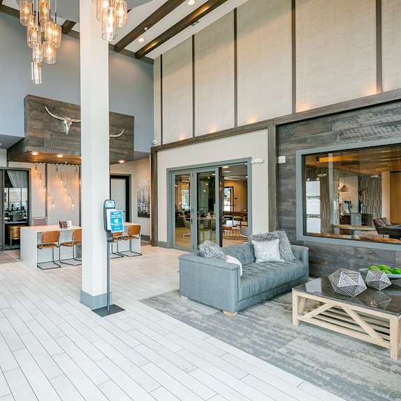 a modern living room with a dining table and chairs.