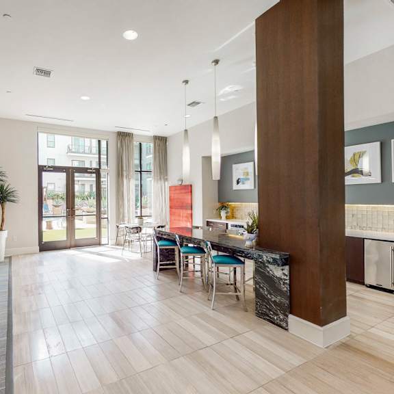 a modern kitchen with a dining table and chairs.