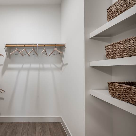 a walk in closet in a 555 waverly unit
