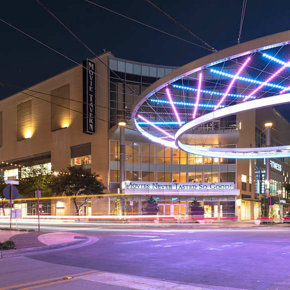 a building with a neon sign that says