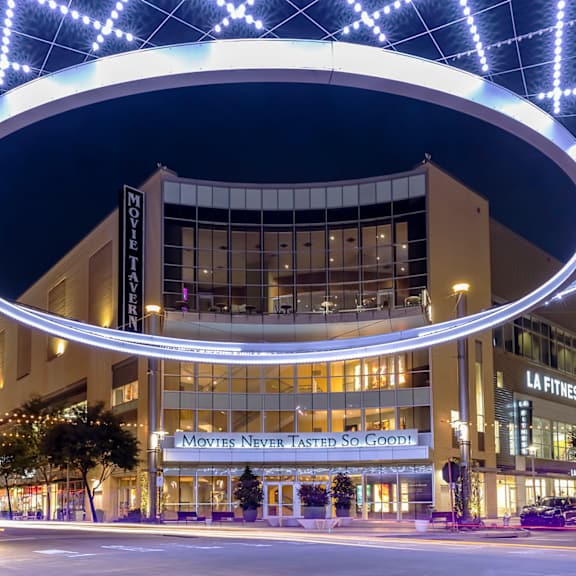 a movie theater with a large marquee that says