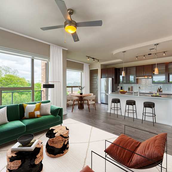 living room with kitchen view at revl heights, the barvin group, houston