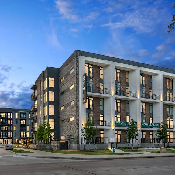 a rendering of a building with a street in front of it