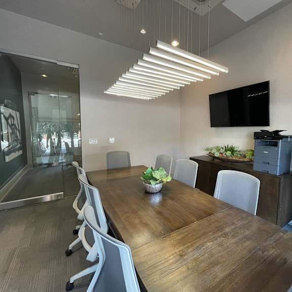 a conference room with a long table and chairs.