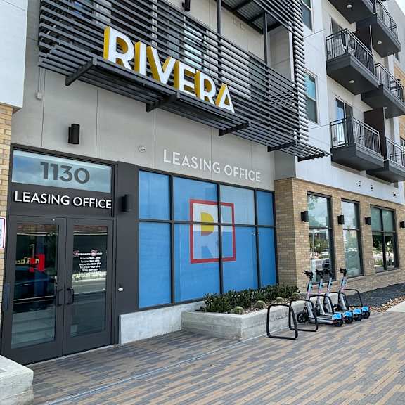 a building with a leasing office for the rivera apartments.