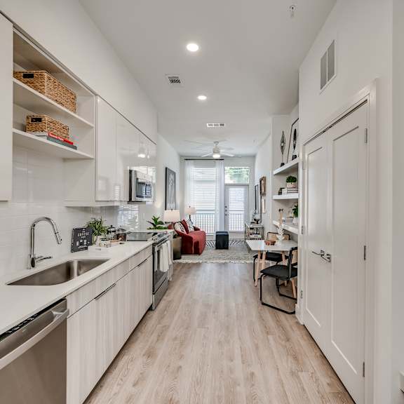a kitchen and living room in a 555 waverly unit