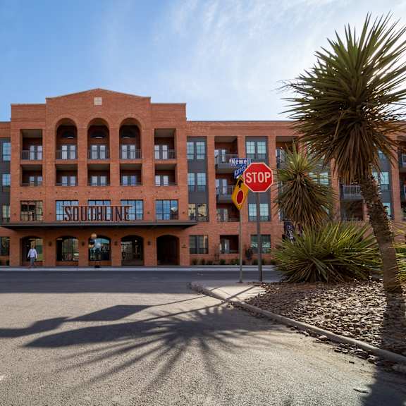 a red brick building with a sign that says "southline" on it.