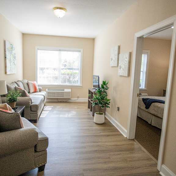modern living room at spring arbor of williamsburg in williamsburg, va