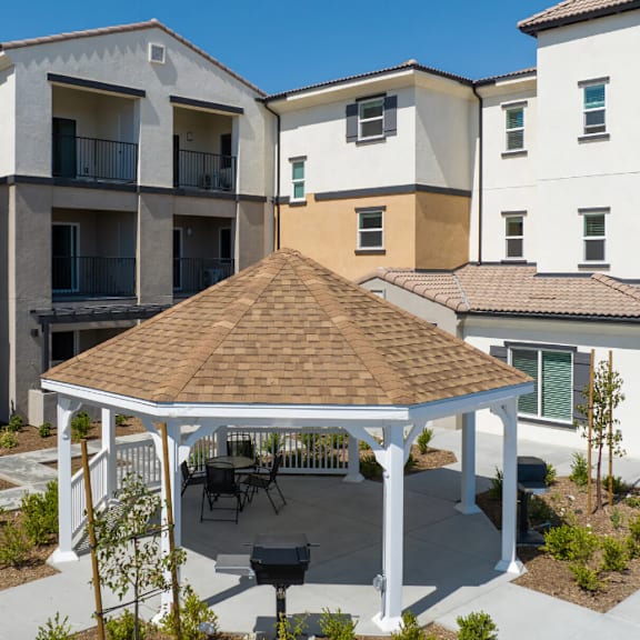 a gazebo in the middle of an apartment complex