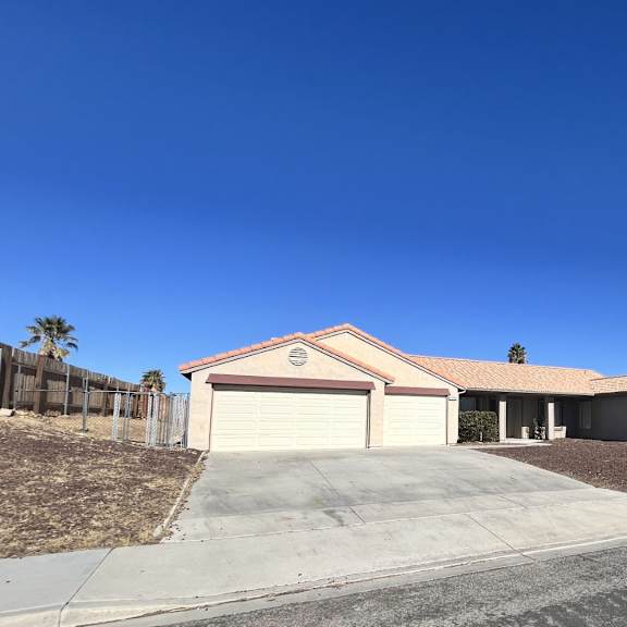 a house with a garage and a driveway.