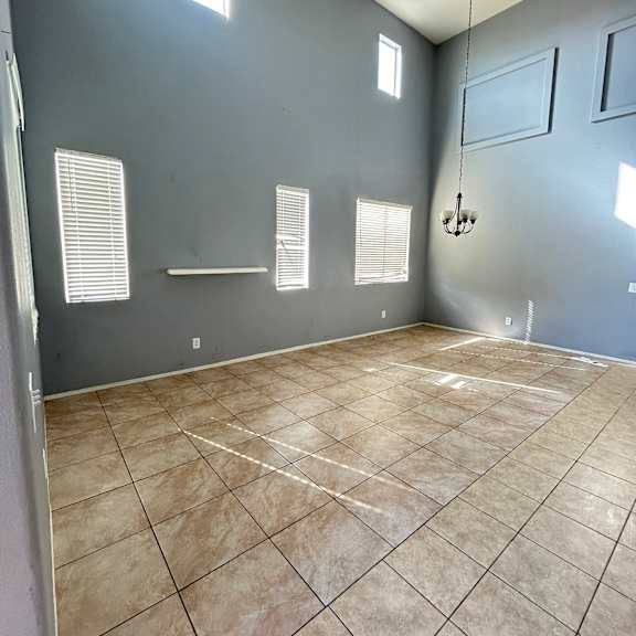 a bathroom with a tiled floor and walls.