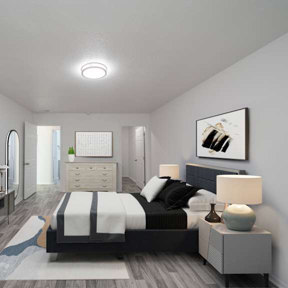 a modern bedroom with a large bed and a television. at red bay apartment complex, jacksonville, fl, 32211