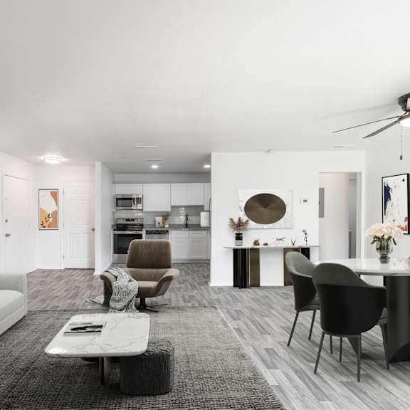 a modern living room with a grey carpet and a white sofa. at red bay apartment complex, jacksonville, fl, 32211