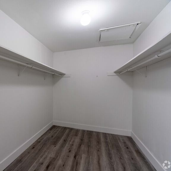 an empty room with white walls and white shelves at red bay apartment complex, jacksonville, fl, 32211