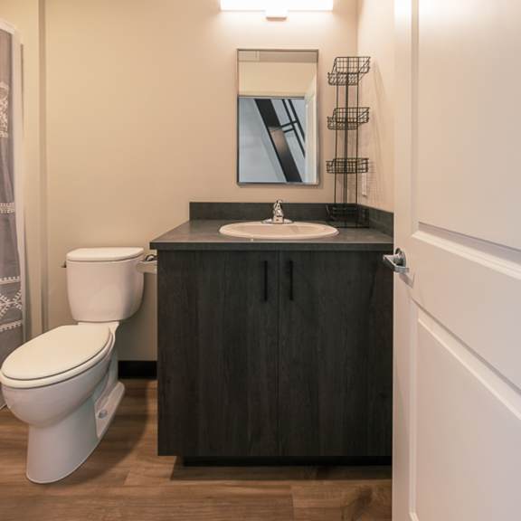 a small bathroom with a toilet sink and mirror