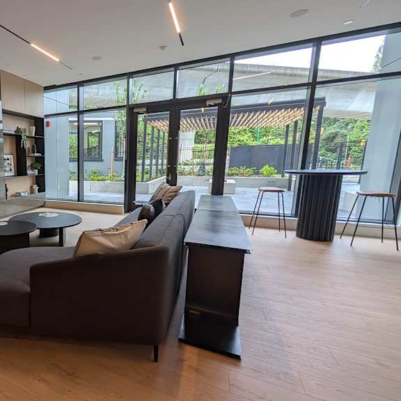 a modern living room with a large couch and a flat screen tv.