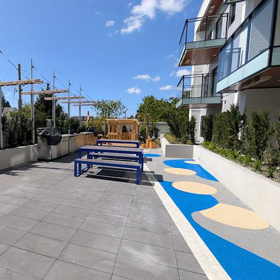 a modern outdoor seating area with red and blue seating.