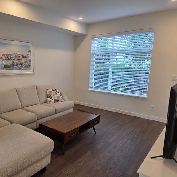 a living room with a large couch and a coffee table.
