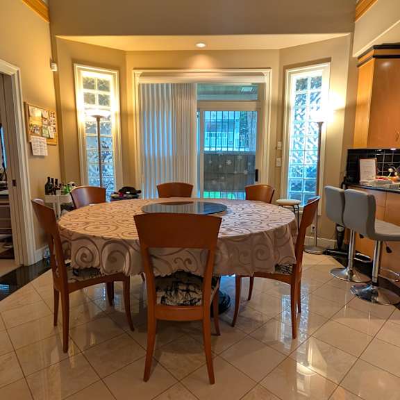 a dining room with a table set for six.