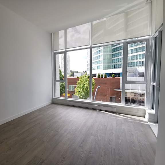 a room with a large window overlooking a cityscape.