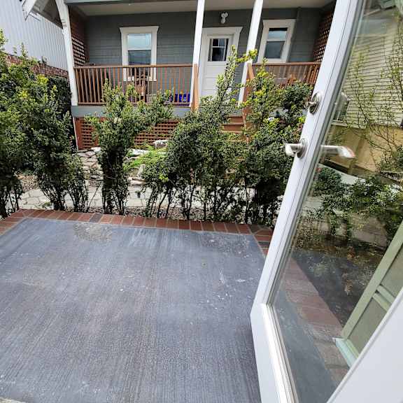 a view of a patio from a doorway.