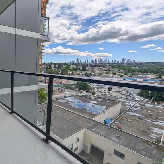 a balcony with a view of a city skyline.