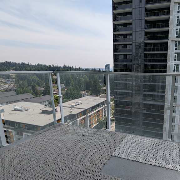 a view from a high-rise building looking down at a cityscape.
