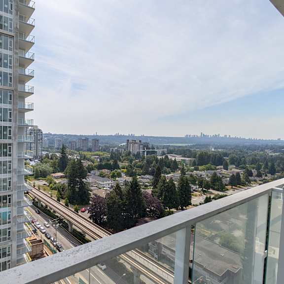 a view from a high-rise building looking out over a cityscape.