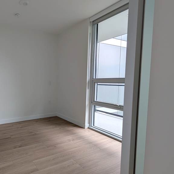 a room with a sliding door and a window.